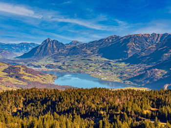 Sarnensee lake in switzerland surrounded by the green mountains.