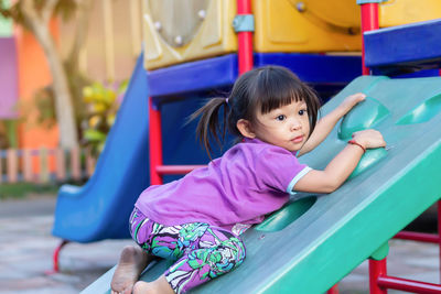 Full length of girl playing at playground