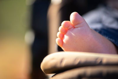 Low section of person with baby feet