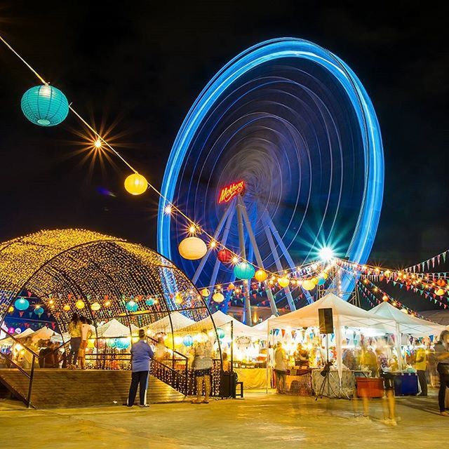 night, illuminated, arts culture and entertainment, amusement park, amusement park ride, leisure activity, men, lifestyles, ferris wheel, built structure, person, lighting equipment, architecture, celebration, multi colored, motion, building exterior, enjoyment, travel destinations