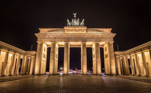 Low angle view of illuminated monument against sky at night