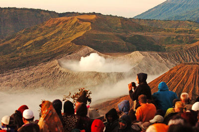 Tourists enjoy the sunrise of mount bromo in east java, indonesia