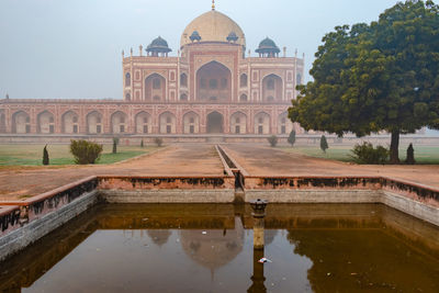 Humayun tomb exterior view at misty morning from unique perspective