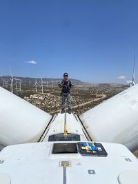 Low angle view of turbine blades against the sky