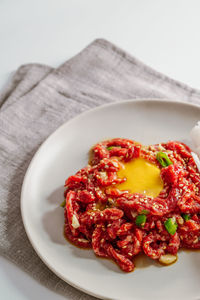 Close-up of red chili peppers in plate on table