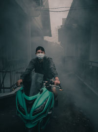 Full length of man standing on foggy day