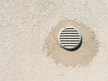 Close-up of air duct mounted in wall