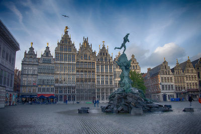 Statue of historic building against sky in city