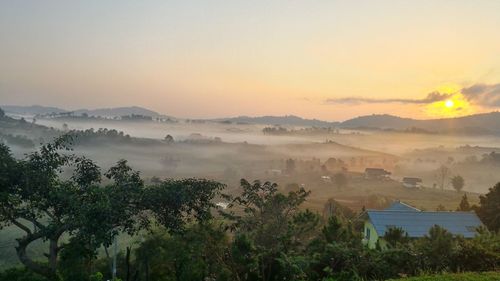 Scenic view of landscape against sky during sunset