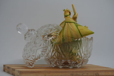 Close-up of ice cream cone on glass table