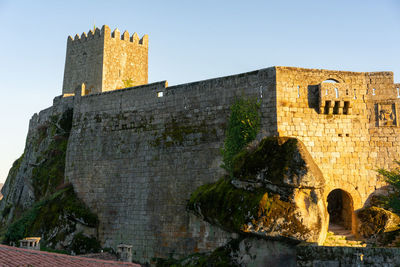 Low angle view of old ruins against clear sky