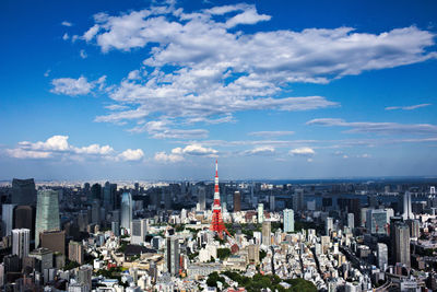 Cityscape against cloudy sky