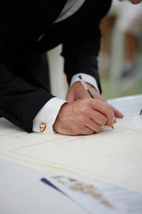 Midsection of business people working at office