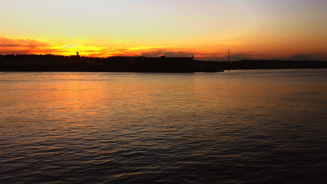 SCENIC VIEW OF SEA AGAINST ORANGE SKY DURING SUNSET