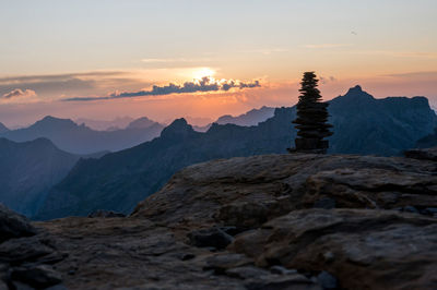 Scenic view of mountains against sky during sunset