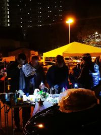 Group of people in restaurant at night