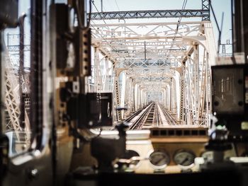 Railroad bridge seen from train windshield