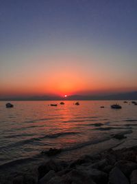 Scenic view of sea against clear sky during sunset