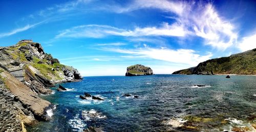 Panoramic view of sea and rocks against sky