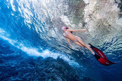 Woman swimming in sea