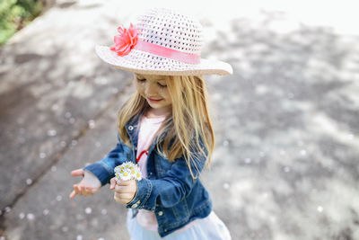 Low section of girl wearing hat