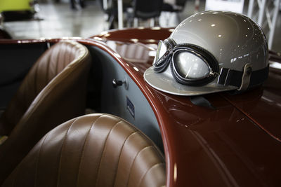 Close-up of helmet on vintage car