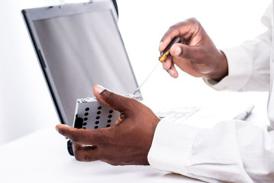 Close-up of man working on table