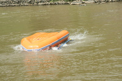 High angle view of boat moored in lake