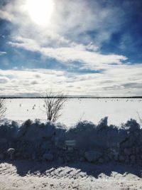 Scenic view of snow against sky during winter