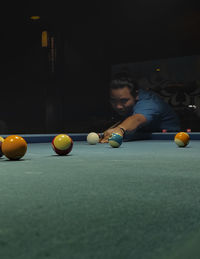 Man playing with ball on table