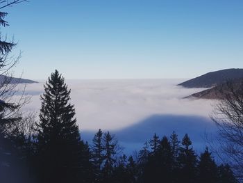 Scenic view of mountains against clear blue sky