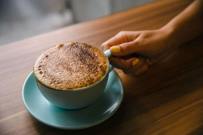 Close-up of coffee cup on table