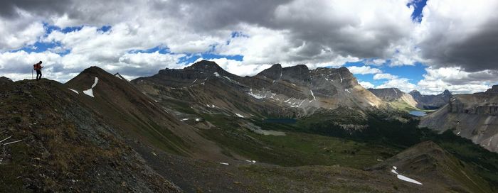 Scenic view of mountains against cloudy sky