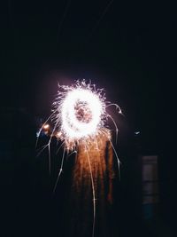 Low angle view of firework display at night