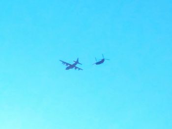 Low angle view of airplane flying in sky