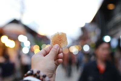 Close-up of hand holding ice cream