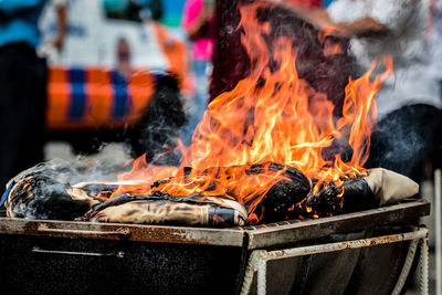 Close-up of fire on barbecue grill