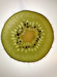 Close-up of fruit over white background