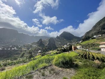 Panoramic view of landscape and houses against sky