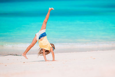 Upside down image of man on beach