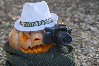 Close-up of man photographing camera