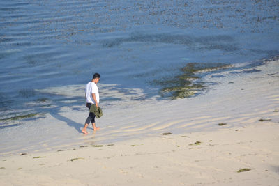 Full length of man walking on beach