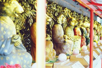 Statues at market stall for sale