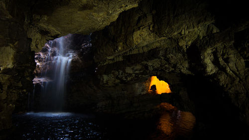 View of waterfall in cave