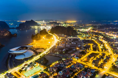 High angle view of illuminated cityscape at night