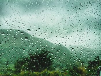 Full frame shot of raindrops on glass window