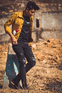 Young man walking on field