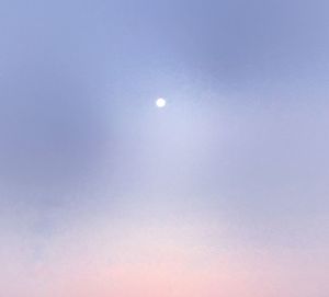 Low angle view of moon against clear sky