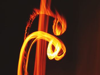 Close-up of light trails against black background