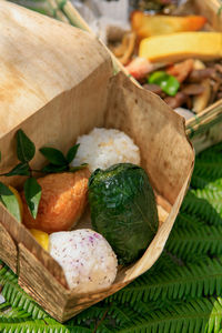 High angle view of vegetables in basket on table